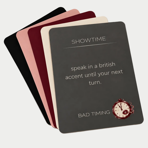 Bad Timing cards fanned out in all five category colors, with a Showtime card on top