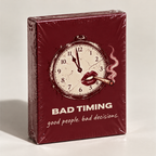 Bad Timing adult party card game, shrink-wrapped deck in burgundy with a cracked pocket watch and red lips